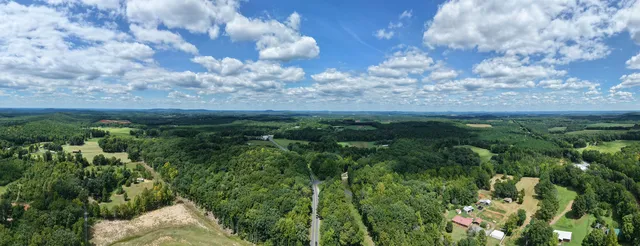 Panoramic view over open land and trees